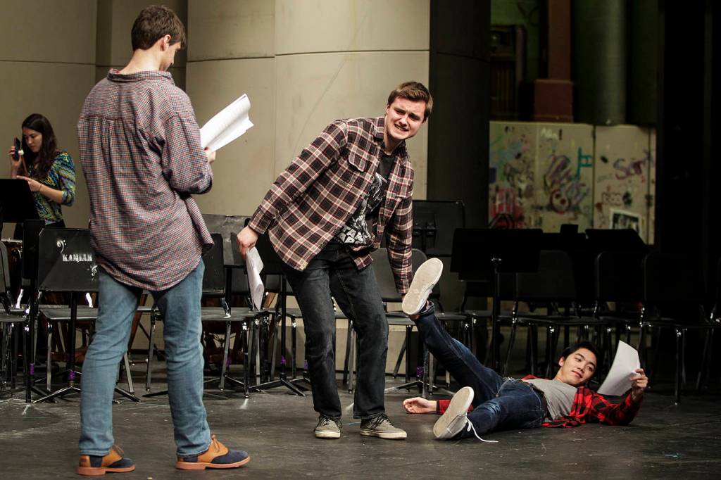 Ian Terry / The Herald Kamiak student Aidan Norris (center) drags Matthew Ninh into a scene as Mitchell Beard (left) reads his lines during an audition for "Spamalot" at the school in Mukilteo on Thursday, Dec. 14. Photo taken on 12142017