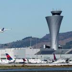 In this Oct. 2017 photo, the air traffic control tower is in sight as a plane takes off from San Francisco International Airport in San Francisco. (AP Photo/Jeff Chiu, file)
