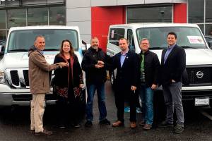 Groups donate vans to Hand in Hand