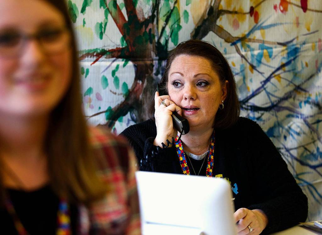 Wee Fit co-owner Melissa Wren takes a call at the front desk Friday at the Everett play facility for children with autism. (Dan Bates / The Herald)