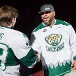 Former Seattle Seahawk Walter Jones shakes hands with Everett Silvertips defenseman Kevin Davis prior to Mondays game against Tri-City. (Christopher Mast/Everett Silvertips)