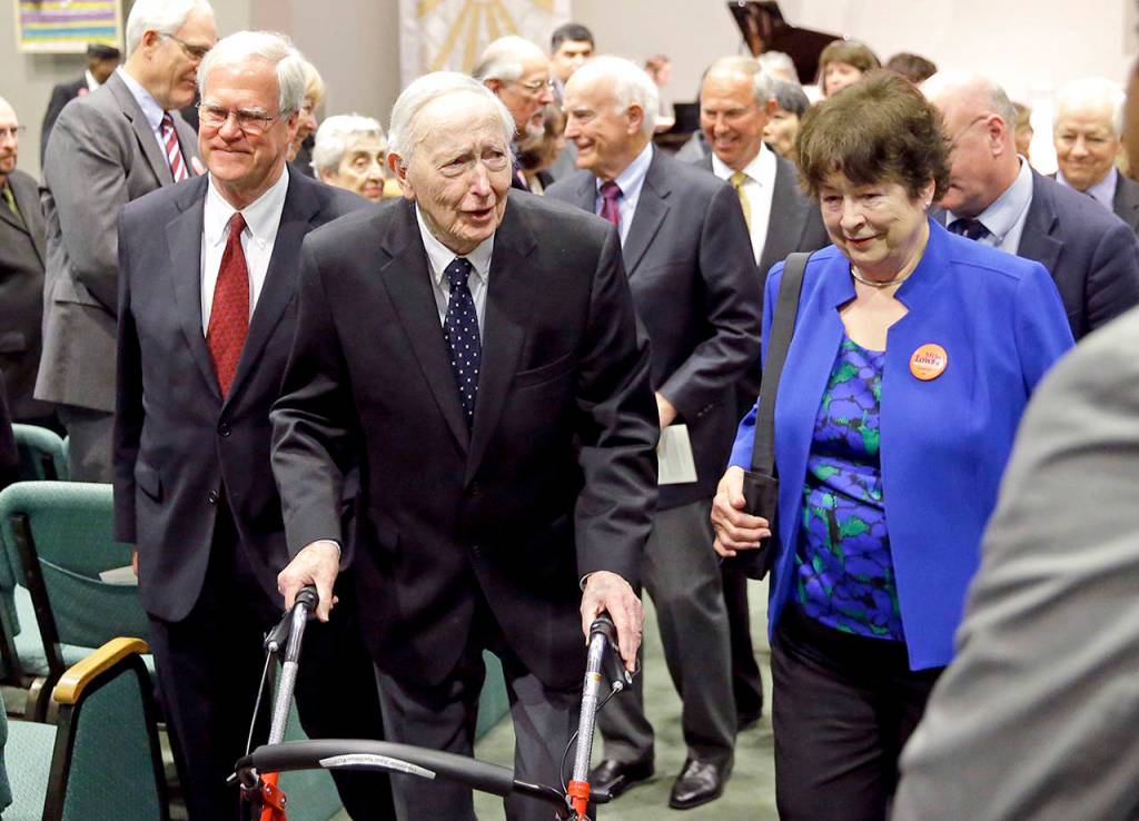 This May 30, 2017 photo shows former Washington Gov. John Spellman (second from left) and Sen. Maralyn Chase, D-Edmonds (in blue), leaving a memorial service in Renton. (AP Photo/Ted S. Warren, File)