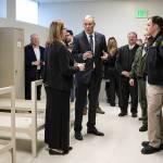 Gov. Jay Inslee (center) talks with law enforcement and health officials as he tours Snohomish Countys former work release building in downtown Everett on Thursday. (Ian Terry / The Herald)