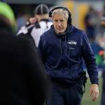 Seahawks head coach Pete Carroll walks on the sideline during the second half of a game against the Cardinals on Dec. 31, 2017, in Seattle. (AP Photo/Elaine Thompson)