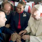 Pope Francis marries flight attendants Carlos Ciuffardi (left) and Paola Podest (center) during a flight from Santiago, Chile, to Iquique, Chile, on Thursday. (LOsservatore Romano Vatican Media/Pool Photo via AP)
