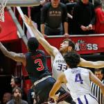 Utah forward Donnie Tillman (3) goes to the basket as Washington forward Sam Timmins (33) defends in the first half of a game Jan. 18, 2018, in Salt Lake City. (AP Photo/Rick Bowmer)