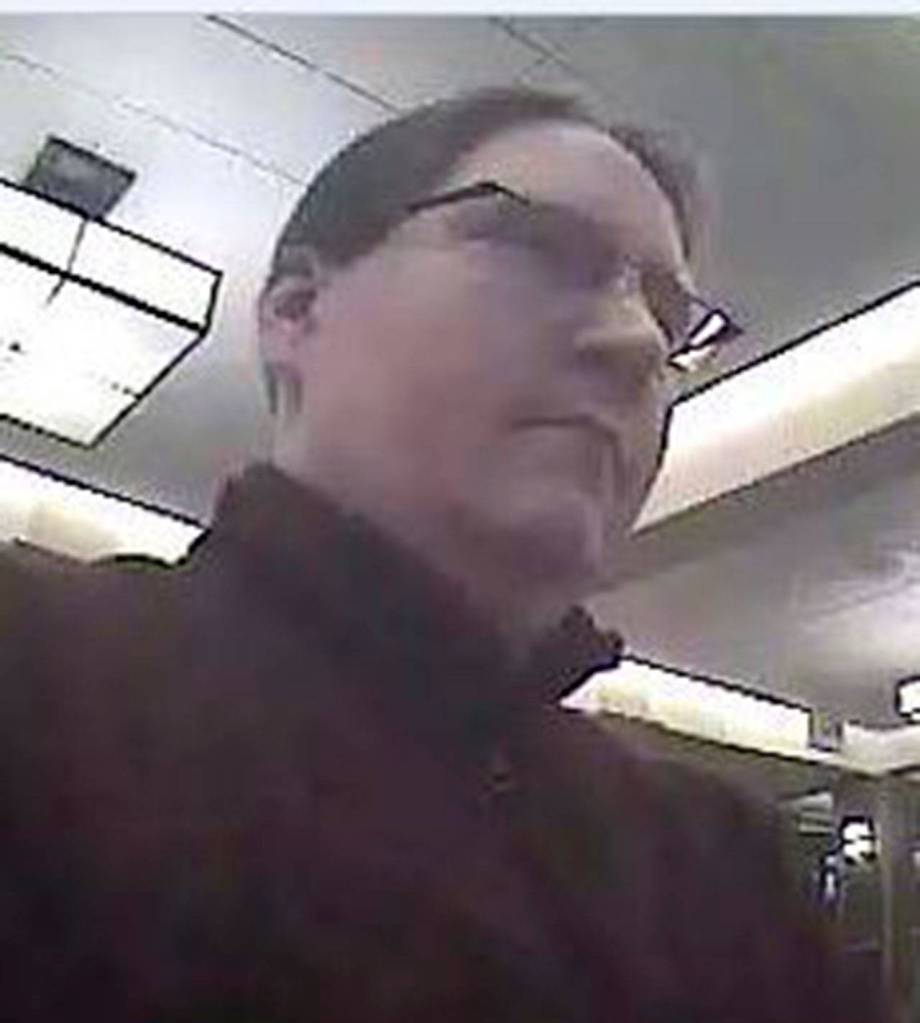 Security photos show a man who robbed a Wells Fargo on Thursday in Lynnwood. Police believe he struck a U.S. Bank on Monday, too. (Lynnwood Police Department)