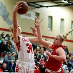 Snohomishs Kyra Beckman (left) goes up for a shot as Stanwoods Kaitlin Larson (right) defends during a game Jan. 24, 2018, at Snohomish High School. (Ian Terry / The Herald)