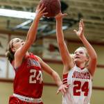 Stanwoods Jillian Heichel (left) takes a shot as Snohomishs Kaylin Beckman (right) defends during a game Jan. 24, 2018, at Snohomish High School. (Ian Terry / The Herald)