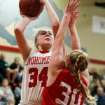 Snohomishs Kyra Beckman (left) takes a shot as Stanwoods Kaitlin Larson (right) defends during a game Jan. 24, 2018, at Snohomish High School. (Ian Terry / The Herald)
