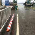 A Cherokee Jeep broke through the crossing arms before driving off the ferry dock and into the water in Anacortes. (Washington State Patrol)