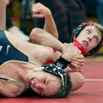 Marysville Pilchucks Tanner Lauzon (right) locks Arlingtons Dorian Tollenaar during a wrestling match Thursday at Marysville Pichuck High School. (Kevin Clark / The Daily Herald)