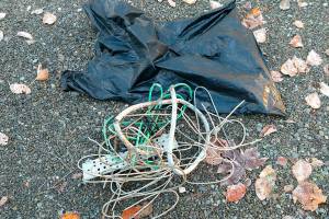 Copper wires and a garbage bag stuffed with bolt cutters were recovered by police last month, when a Lynnwood man, 30, was caught stealing from a 911 radio tower in Marysville, according to charging papers. (Courtesy of Snohomish County Emergency Radio System)