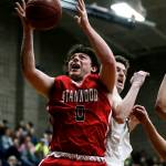 Stanwoods Mitch Jones (0) grabs a rebound during a game against Arlington on Jan. 26, 2018, at Arlington High School. (Ian Terry / The Herald)