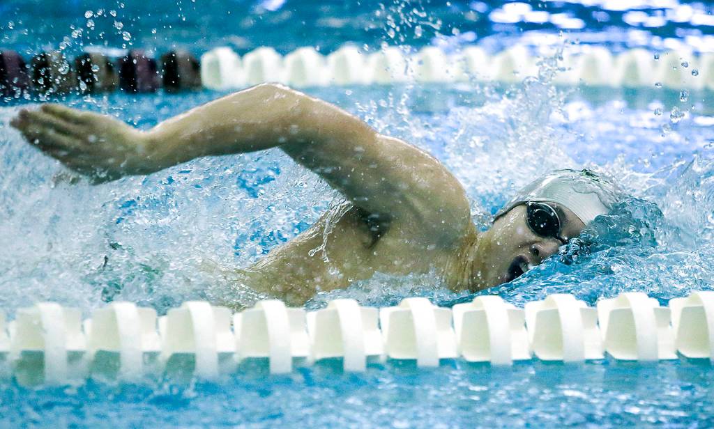 Jacksons Justin Limberg takes a breath on his way to winning the 200 freestyle race during a meet against Kamiak at Kamiak High School in Mukilteo on Jan. 25. (Ian Terry / The Herald)