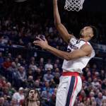 Gonzaga forward Johnathan Williams (right) shoots in front of San Francisco forward Matt McCarthy (left) during a game in Spokane Saturday. Gonzaga won 82-73. (AP Photo/Young Kwak)