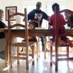 Artist and author Maybeth Morales, left, leads a home school art class for her grandchildren as her daughter Chemay Morales-James, right, and son-in-law Shane, center, watch in Watertown, Conn., on Jan. 26, 2018. Reports that 13 malnourished siblings allegedly held captive by their parents were home-schooled has others who educate their children at home bracing for calls for more oversight of the practice, a reaction they say would unfairly punish families. (AP Photo/Jessica Hill)