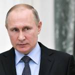 President Vladimir Putin attends the ceremonial signing of a general agreement between Russian trade unions, employers and the government in Moscow, Russia, on Monday. (Alexei Nikolsky, Sputnik, Kremlin Pool Photo via AP)