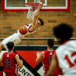 Mountlake Terraces Khyree Amrstead (center) throws down a dunk during a decisive victory over Stanwood at Mountlake Terrace High School on Tuesday, Jan. 30. (Ian Terry / The Herald)