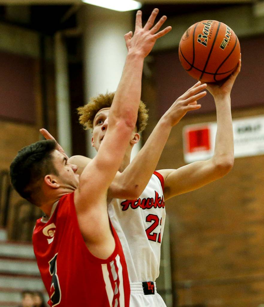 Mountlake Terraces Khyree Amrstead (right) takes a shot during a game against Stanwood at Mountlake Terrace High School on Tuesday, Jan. 30. (Ian Terry / The Herald)