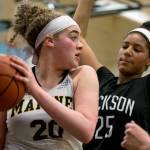 Mariners Taliyah Clark with a rebound look to pass with Jacksons Sydney Carter defending Wednesday night at Mariner High School in Everett on January 31, 2018. (Kevin Clark / The Daily Herald)