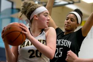 Mariners Taliyah Clark with a rebound look to pass with Jacksons Sydney Carter defending Wednesday night at Mariner High School in Everett on January 31, 2018. (Kevin Clark / The Daily Herald)