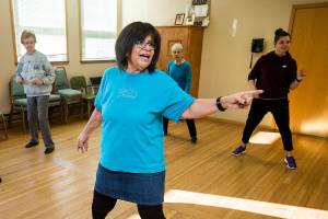 Lilia Smith, 62, a retired Boeing worker teaching line dancing classes at the Stanwood Senior Center on Wednesday, Jan. 3, 2018 in Stanwood, Wa. Smith lost 98 pounds, going from 270 to 172 pounds. She credits it to TOPS, Take Off Pounds Sensibly. (Andy Bronson / The Herald)