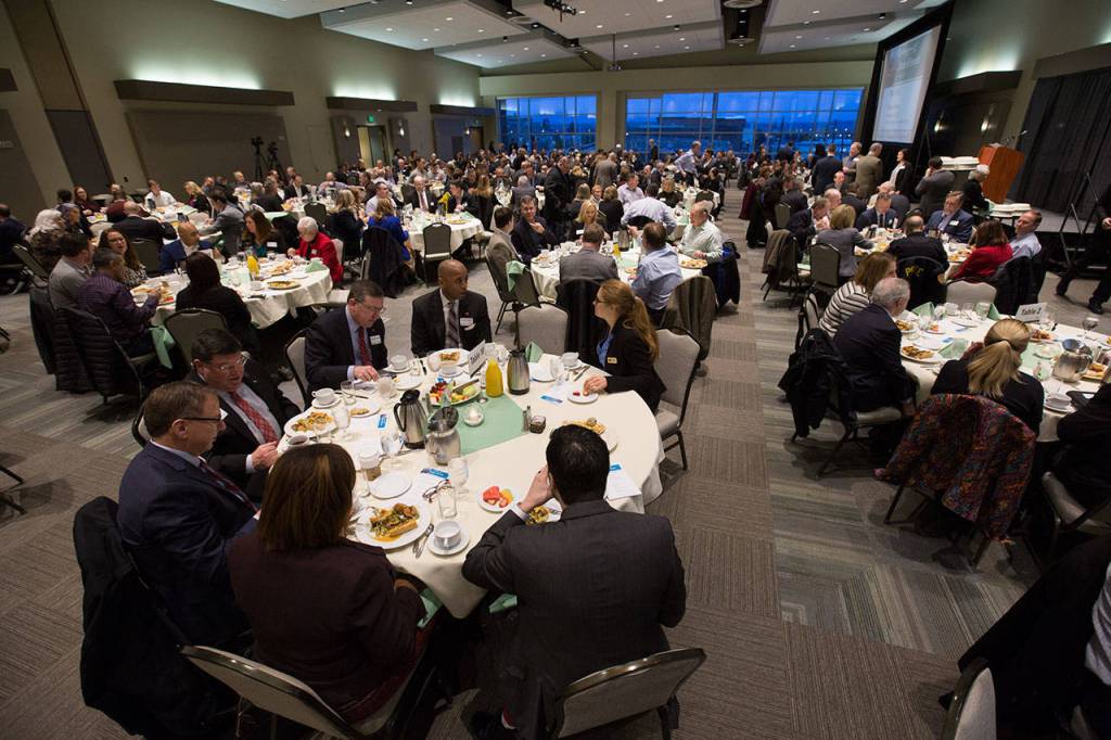 Guests eat before Everett Mayor Cassie Franklin delivers her first of State of Everett address held at the Ed Hansen Conference Center in the Angel of the Winds Arena on Wednesday in Everett. (Andy Bronson / The Herald)