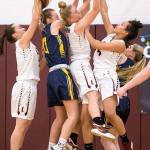 Lakewoods Jelly Perry (1) goes up in a crowd and grabs a rebound during a game against Everett on Dec. 27, 2017, at Lakewood High School in Arlington. (Andy Bronson / The Herald)