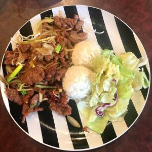 Mongolian beef is served with rice and salad for $8.95 at Umami Asian Cuisine in Mukilteo. (Andrea Brown/The Herald)