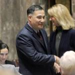 Senator Steve Hobbs, D-Lake Stevens, shakes hands with Senator Patty Kuderer, D-Bellevue, after SB 6219 passed the senate chamber. (Taylor McAvoy / WNPA Olympia News Bureau)
