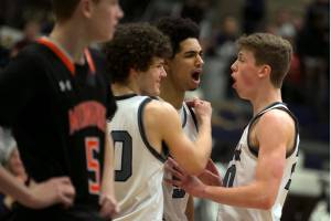 Glacier Peak celebrates a score and a foul Thursday night at Glacier Peak High School in Snohomish February 1, 2018. (Kevin Clark / The Daily Herald)