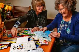 On her 90th birthday Monday, Doris Goertz of Lake Stevens and her daughter, Rachel OBrien, read some pretty hilarious notes as they go through some of the 186 or so letters and cards Goertz recieved after OBrien recruited friends to send them snail mail instead of email. (Dan Bates / The Herald)