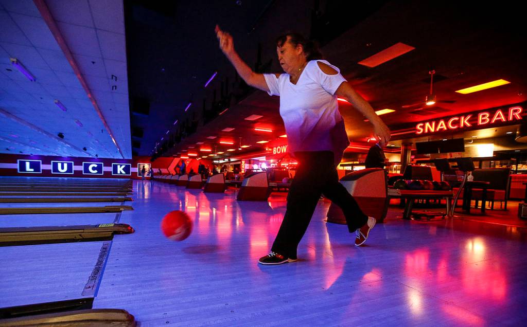 Melanie Brice bowls at the renovated Bowlero in Lynnwood. (Ian Terry / The Herald)
