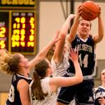Arlingtons Peyton Brown pulls down a rebound Friday at Shorecrest High School. (Kevin Clark / The Daily Herald)