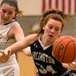 Arlingtons Kelsey Mellick reaches for a loose ball Friday night at Shorecrest High School in Shoreline on February 2, 2018. (Kevin Clark / The Daily Herald)