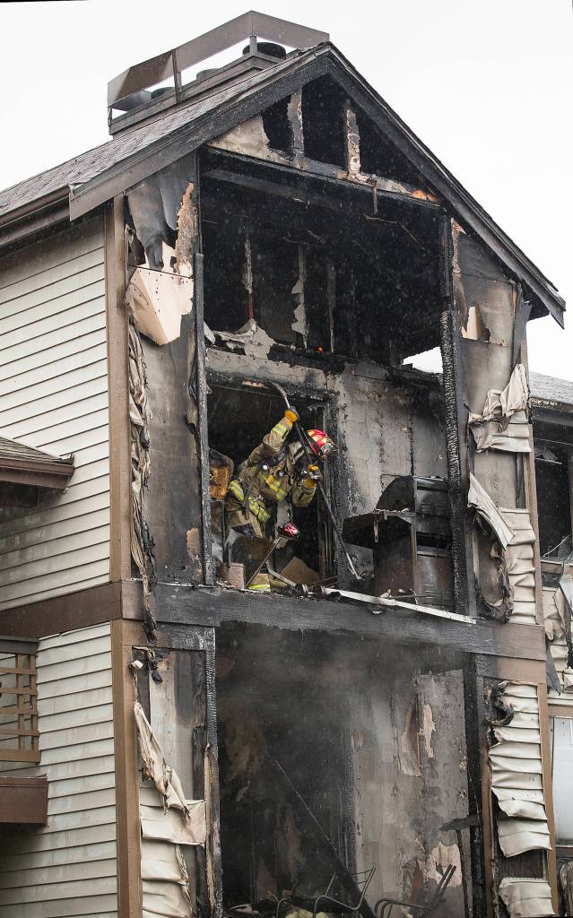 Fire burned an apartment building at 10115 Holly Drive on Jan. 29 in Everett. (Andy Bronson / The Herald)
