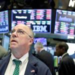 Trader Frederick Reimer works on the floor of the New York Stock Exchange on Tuesday. (AP Photo/Richard Drew)