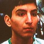 Brian Varela is seen on a video monitor during his arraignment on Wednesday in Everett District Court. (Andy Bronson / The Herald)