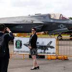 Visitors take a photo with a U.S. F-35B fighter jet during the Singapore Airshow on Wednesday. (AP Photo/Yong Teck Lim)