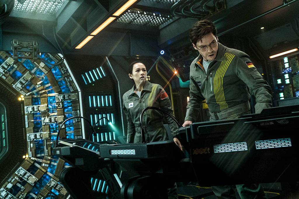 Ziyi Zhang, left, and Daniel Bruhl man a space station in a scene from The Cloverfield Paradox. (Scott Garfield/Netflix)