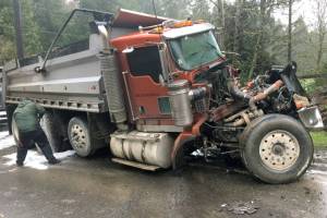Crews clean oil spill after dump trucks crash in Marysville