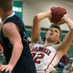 Marysville-Pilchucks Aaron Kalab attempts a shot past Arlingtons Caden Smith during the 3A semifinals Thursday night at Henry M. Jackson High School in Everett on February 14, 2018. (Kevin Clark / The Daily Herald)