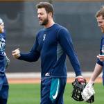 The Mariners Mitch Haniger (center) talks with Ben Gamel (right) as Taylor Motter (left) throws a baseball during an informal workout at Seattles spring training complex on Feb. 14, 2018, in Peoria, Ariz. (AP Photo/Ross D. Franklin)