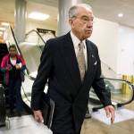 Senate Judiciary Committee Chairman Chuck Grassley, R-Iowa, walks through a basement passageway at the Capitol amid debates in the Senate on immigration in Washington on Wednesday. (AP Photo/J. Scott Applewhite)