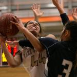Lake Stevens Kylee Griffen (left) attempts a shot with Glacier Peaks Makayla Guerra defending during the 4A district championship on Feb. 15, 2018, at Everett Community College. (Kevin Clark / The Herald)