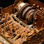 An Enigma machine destroyed by German troops in the field is displayed at SPYSCAPE in New York. Visitors to a new attraction opening in New York City can learn about the elements of spying, its history and find out what kind of spy they could be. SPYSCAPE opens Friday. (Seth Wenig / Associated Press)