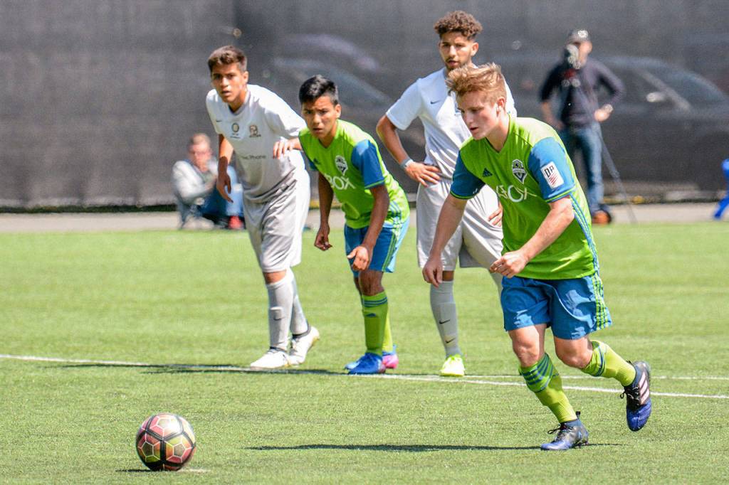 Conner Drought, a junior at Kamiak High School, sets to take a free kick during a match with the Seattle Sounders Academy at Starfire Sports in Tukwila. (Sounders Academy photo)