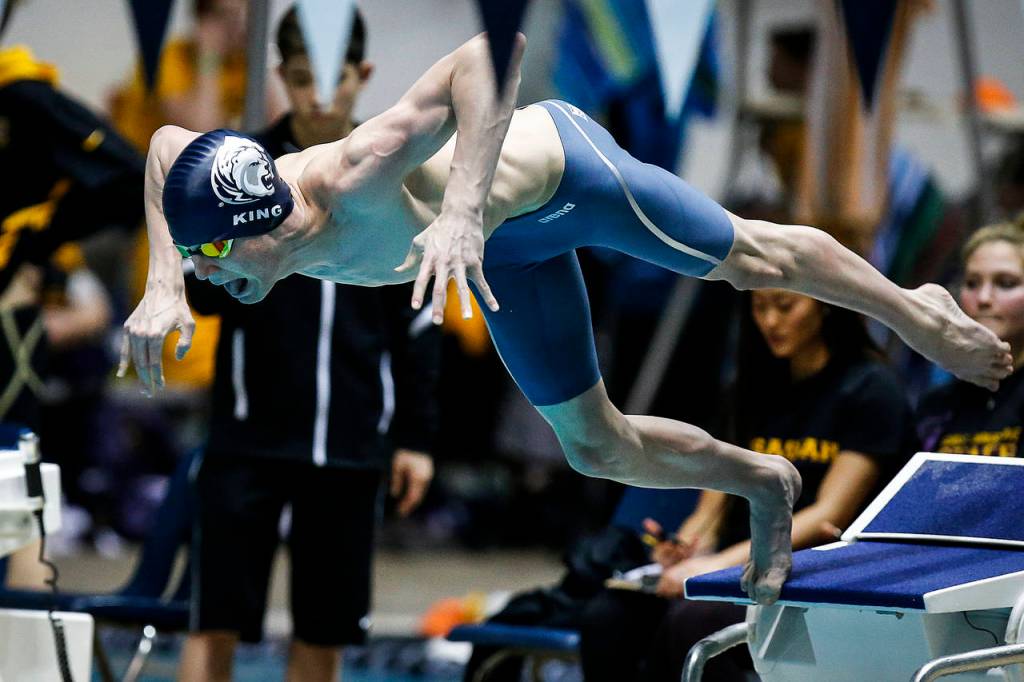 Glacier Peaks Matthew King takes off at the start of the 100-yard freestyle race, which he won Saturday at the 4A state boys swimming and diving championships at the King County Aquatic Center in Federal Way. (Ian Terry / The Herald)
