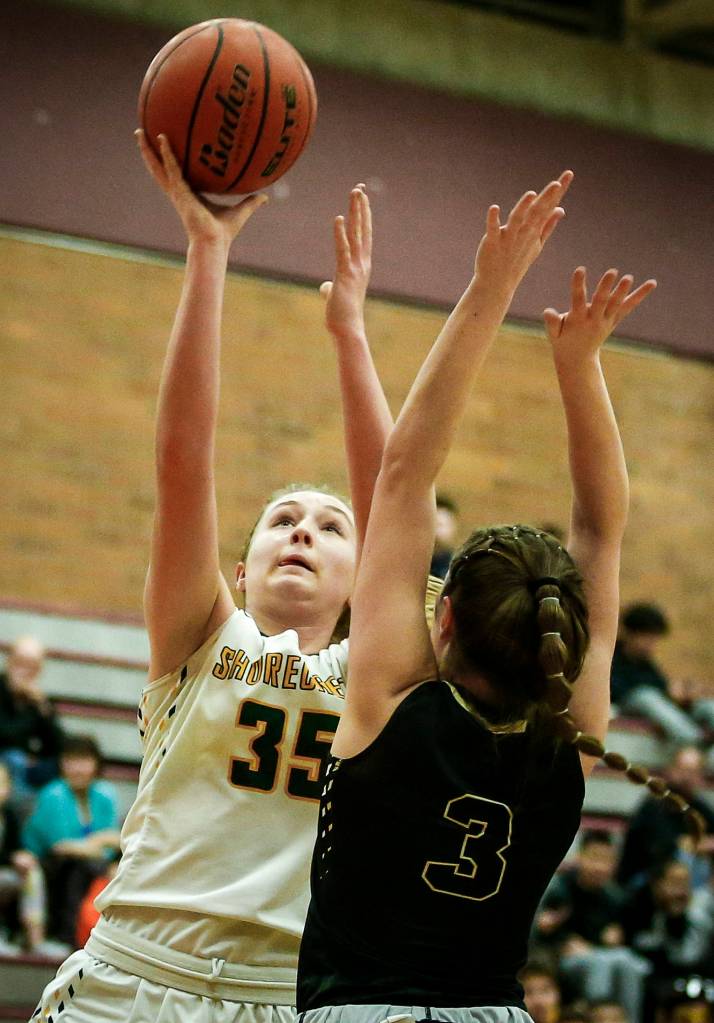 Shorecrests Audrey Dietz (35) takes a shot as Lynnwoods Rachel Walsh (3) defends during a game at Mountlake Terrace High School on Feb. 13. <a href="https://www.heraldnet.com/sports/strand-shorecrest-girls-oust-lynnwood-in-58-36-district-win/" target="_blank"><strong></strong></a>(Ian Terry / The Herald)